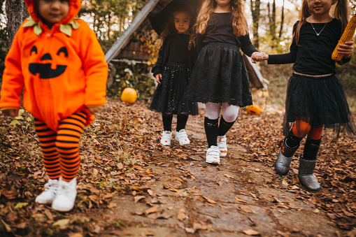 playing as witch at Halloween in the forest