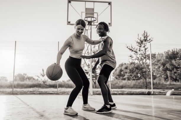 istock Multi-ethnic couple playing basketball 1336690846