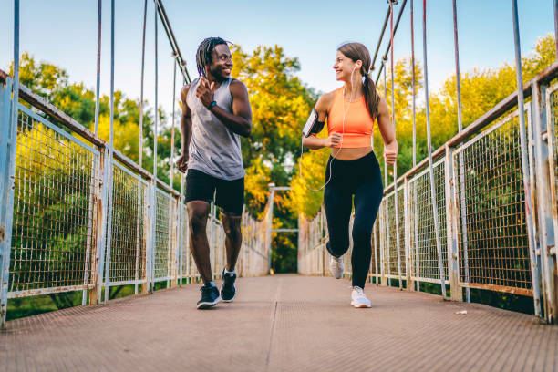 istock Athletic couple running together 1336690867