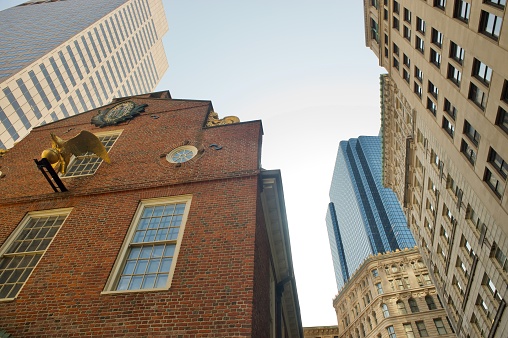 in boston downtown, one historic building surrounded by different modern buildings