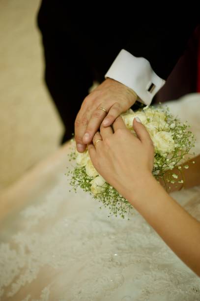istock hands of new married 1336692655