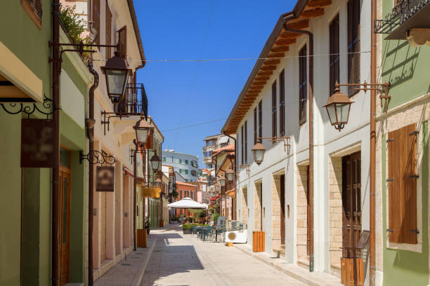 Vlora Typical street in historic center with colorful buildings. Vlora Typical street in historic center with colorful buildings. narrow streets stock pictures, royalty-free photos & images