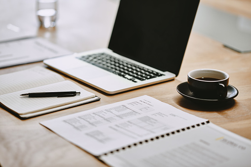 Shot Of A Notebook And Laptop In An Office Stock Photo - Download Image Now  - Desk, Meeting, Office - iStock