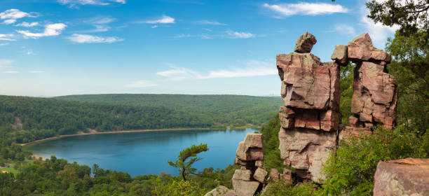 View from Devil's Doorway Panoramic view of Devil's Doorway rock formation with beautiful landscape in the background. state park stock pictures, royalty-free photos & images