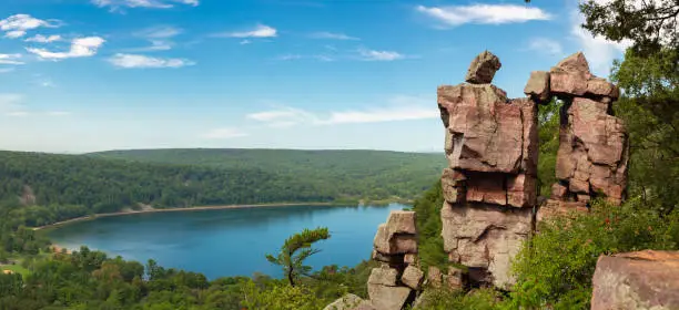 Panoramic view of Devil's Doorway rock formation with beautiful landscape in the background.