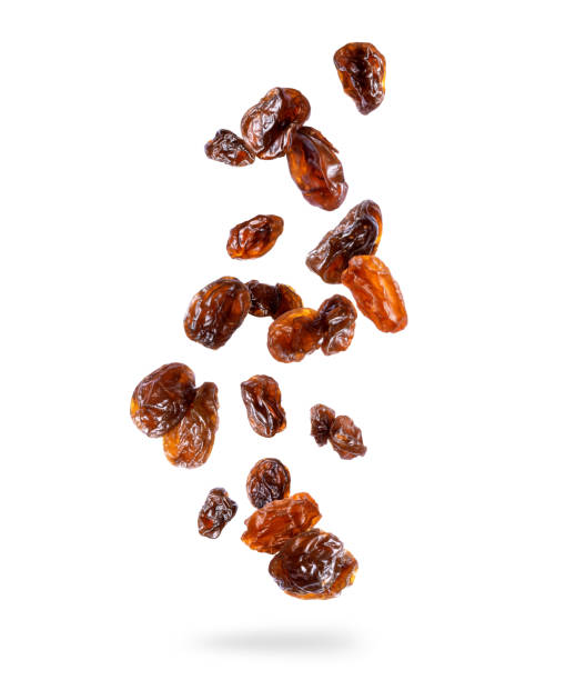 Delicious raisin in the air isolated on white background Delicious raisin in the air isolated on white background raisin stock pictures, royalty-free photos & images