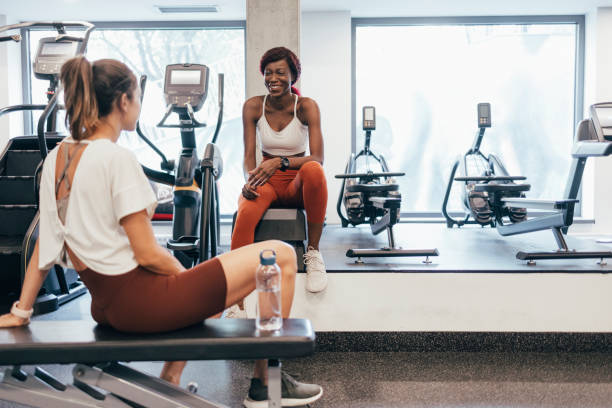 istock Two Sportswomen Talking at the Gym after an Intense Workout 1336700415