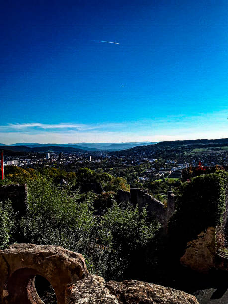 istock View over the mountains with an airplane in the sky 1336701906