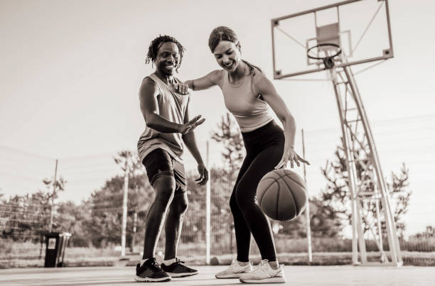 istock Multi-ethnic couple playing basketball 1336703232