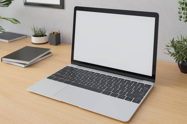 istock Laptop with on the table in modern interior. 1336703983