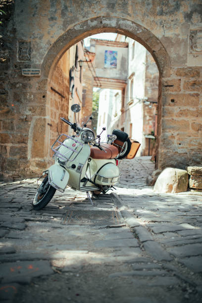 istock Woman and her scooter 1336706121