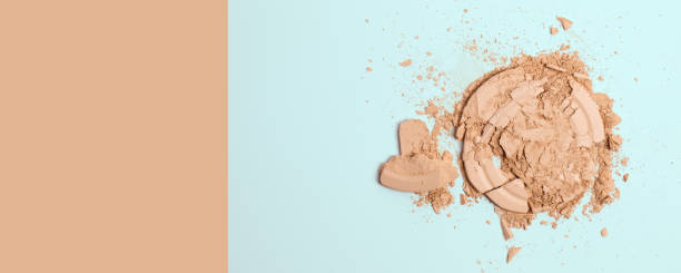 istock Crashed face finishing powder isolated on light blue and beige background. Copy space 1336707371