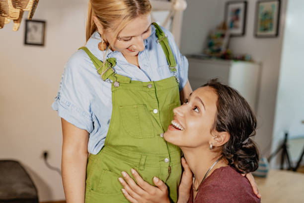 istock Happy lesbian couple waiting for baby 1336708540