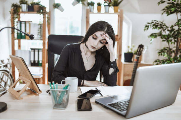 istock Goth Female Office Worker Tired After Stressful Day 1336709199