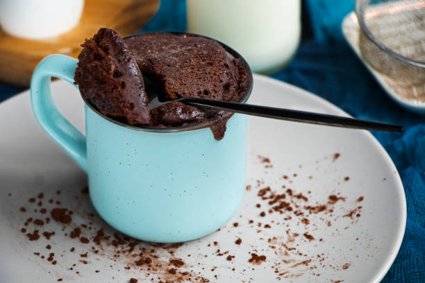 istock mugcake is microwaved. Homemade cupcake in a mug is on a plate. 1336713279