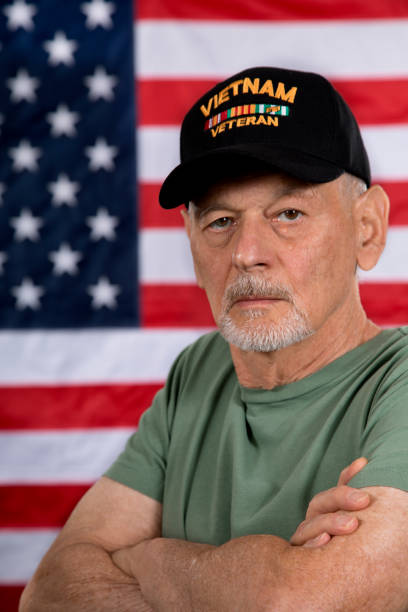 istock Vietnam Veteran with tears, arms folded looking at camera 1336714005