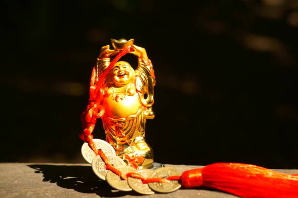 istock Buddha statuette with Chinese coins close-up. 1336715152