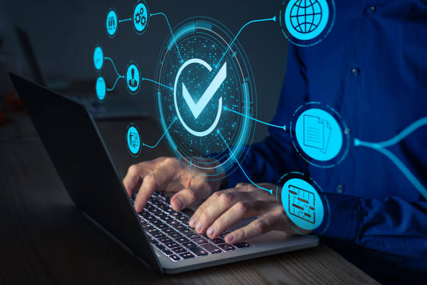 Quality Assurance and certification. Certified internet businesses and services. Compliance to international standards and regulations. Concept with consultant in QA management working on computer. stock photo