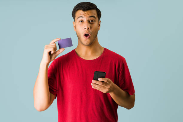 istock Attractive man using the best credit card 1336717598