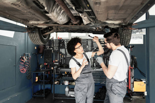 istock Group of Mechanic Vehicle Service Maintenance Under Car 1336720734