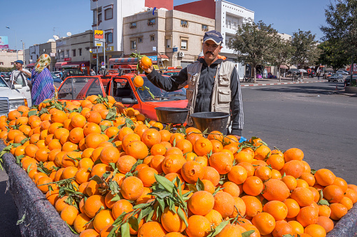 Agadir, Morocco - march 01, 2016: Orange seller outside the Souk El Had market in the urban center