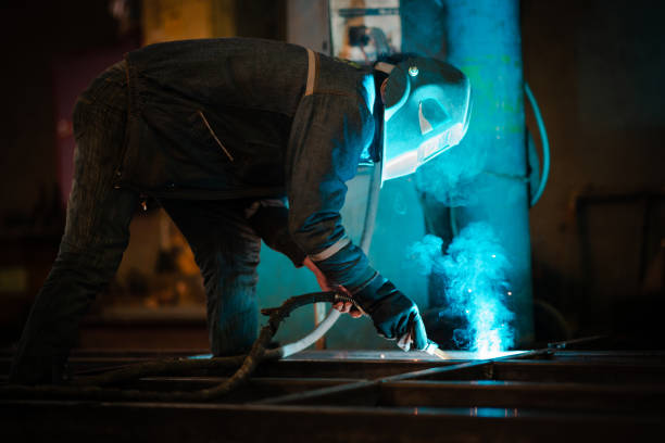 istock Welder working in factory 1336722453