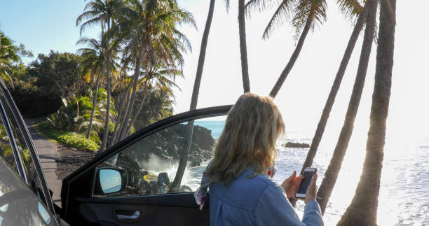 istock Woman enjoys driving along coastal road 1336724393