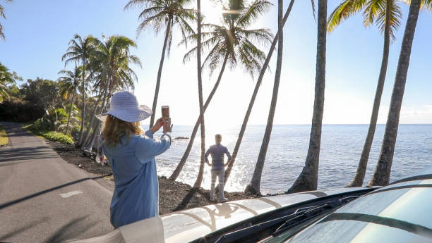 istock Couple enjoy driving along coastal road 1336724482