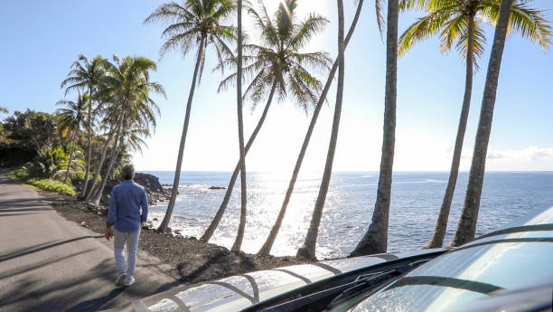 istock Man enjoys driving along coastal road 1336724503