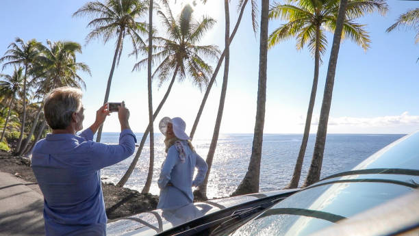 istock Couple enjoy driving along coastal road 1336724526