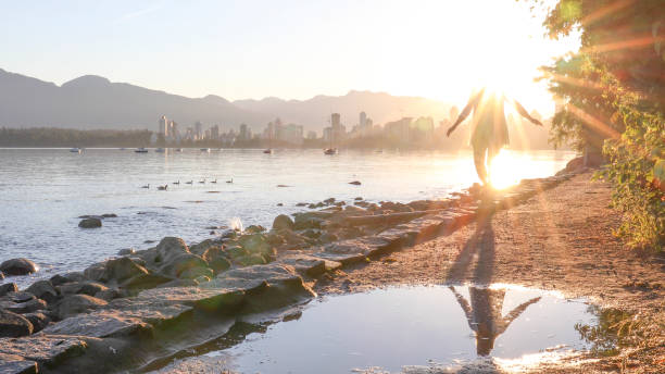 istock Woman enjoys walking along coastal pathway 1336724547