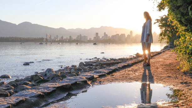 istock Woman enjoys walking along coastal pathway 1336724553