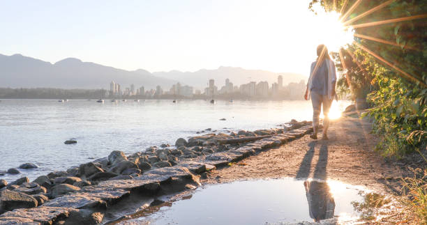 istock Woman enjoys walking along coastal pathway 1336724639