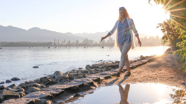 istock Woman enjoys walking along coastal pathway 1336724646