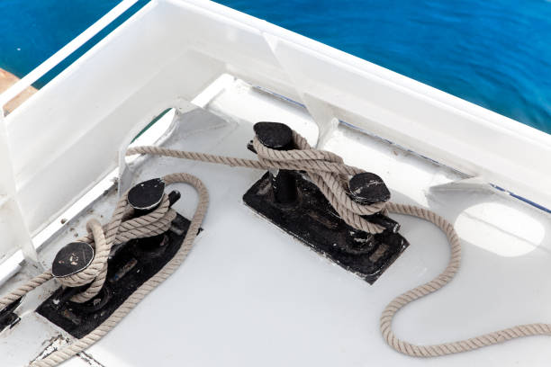 istock Boat double bitt with rope moored in port 1336725765