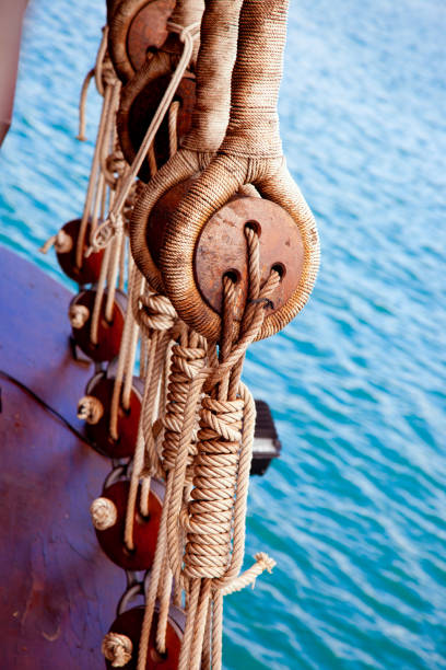 istock Ancient wooden sailboat pulleys and ropes 1336725974