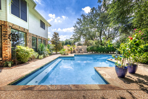 Backyard oasis with a swimming pool inside a private residential backyard