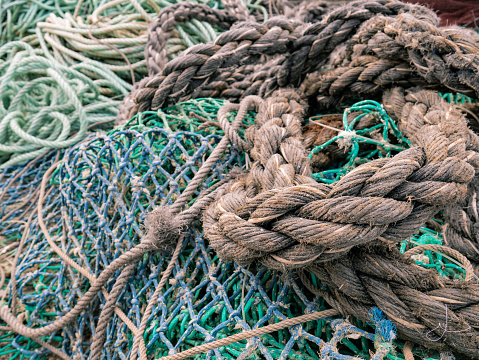 Old And Unraveled Fishing Ropes And Nets Grouped Together Stock Photo ...