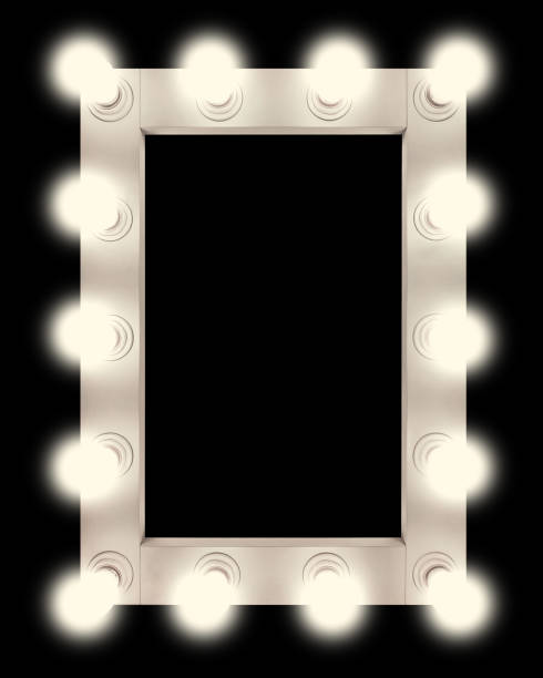 istock Vintage white mirror frame with glowing lamps, isolated on black background. Make-up mirror with built-in lamps. Professional luminous mirror with reflection. 1336734554