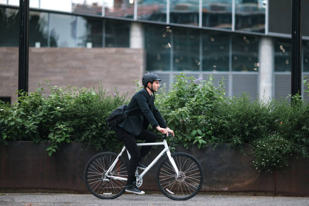 Bike Riding Urban Commuter at Dusk stock photo