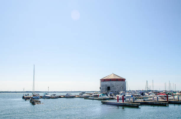 kingston's marina with boats and martello (murney) tower - martello towers imagens e fotografias de stock