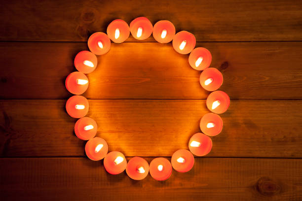 candles cirlce shape on warm golden wood