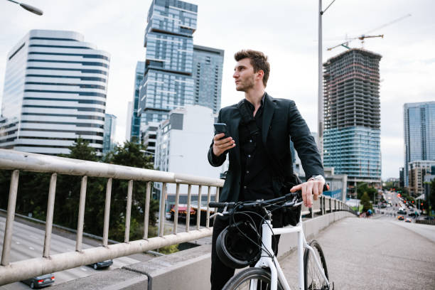 istock Bike Riding Urban Commuter Using Smart Phone 1336744471