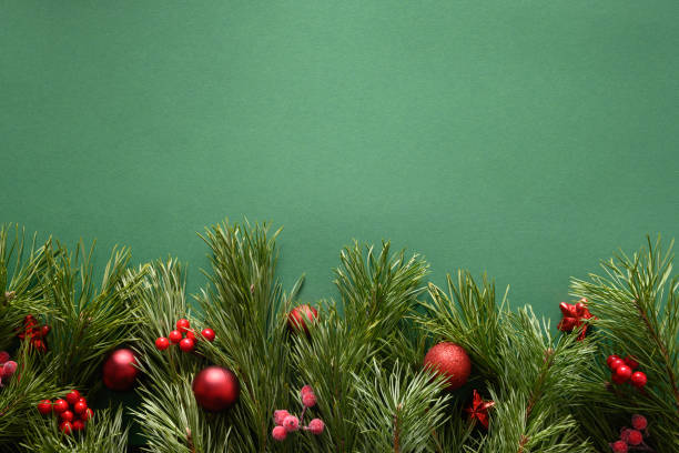 istock Christmas frame with pine branches , red balls. Xmas greeting card. Happy New Year. View from above, flat lay. 1336747779