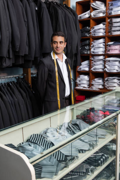 istock Tailor waiting for clients at his shop 1336753662