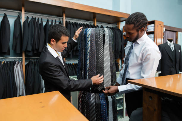 istock Tailor showing ties to black client at  shop 1336753669