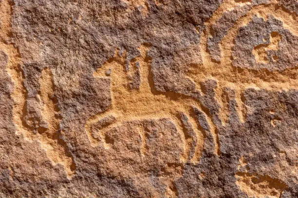 Photo of Petroglyphic image of a horseman on the Graffiti Rock (Qaryat al Asba)