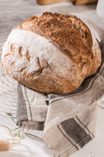 istock Freshly artisan baked wheat and rye bread, country bread. Simple bread for breakfast 1336760597