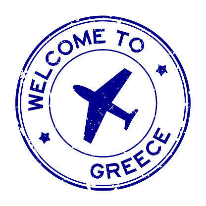 Grunge blue welcome to Greece word with airplane icon round rubber seal stamp on white background