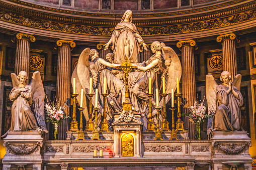 Mary Madeleine Angels Statues Altar Crucifix La Madeleine Church Paris France. Catholic church created in 1800s as Temple to glory of Napoleon's army, later renamed for Mary Magdalene
